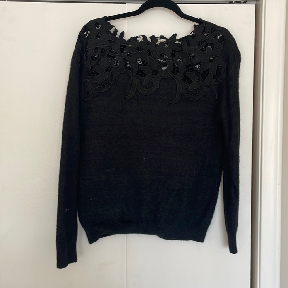 Black sweater with floral neck detail